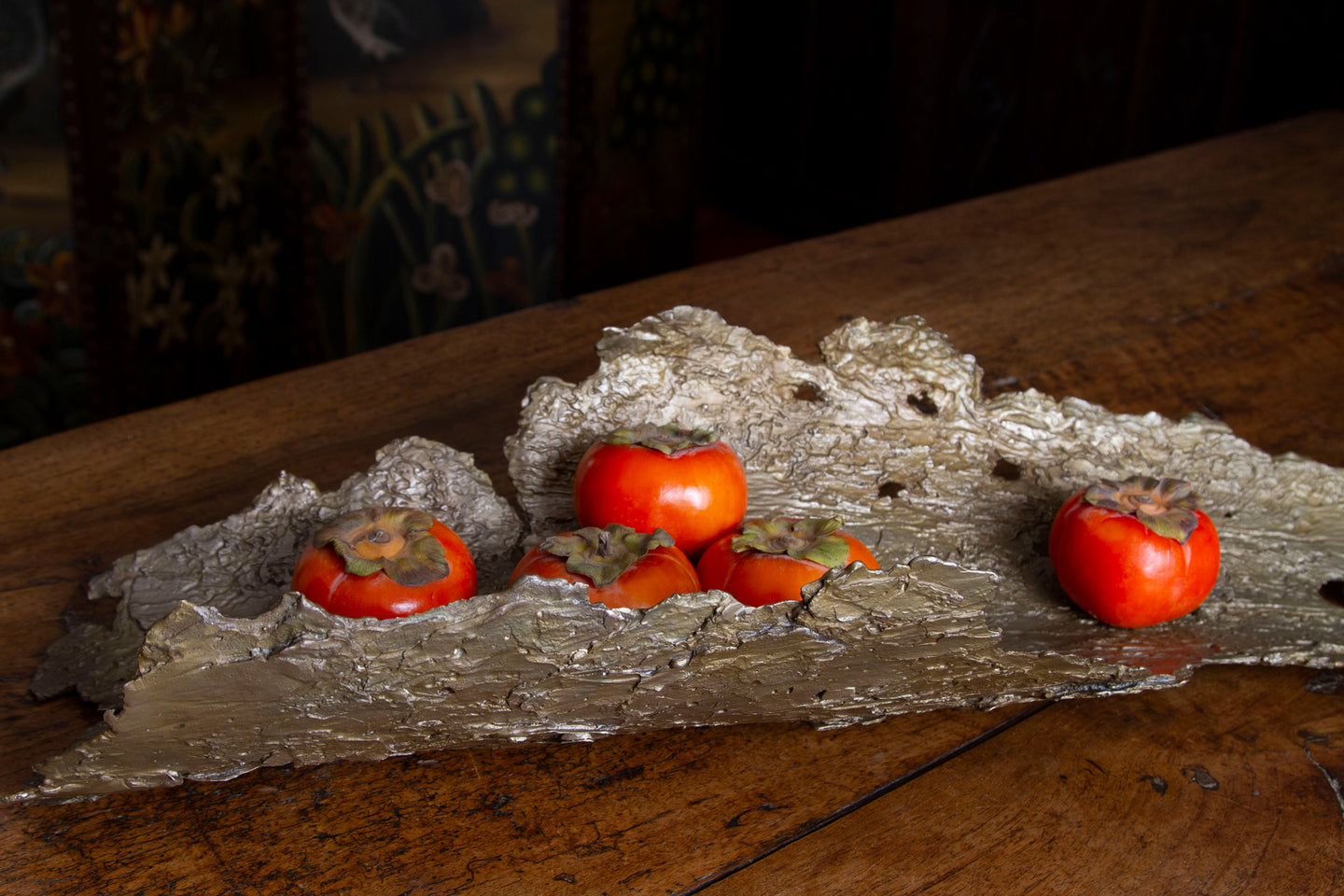 Bronze bowl cast from tree bark, displaying complex textures of termite trails and flaky bark.