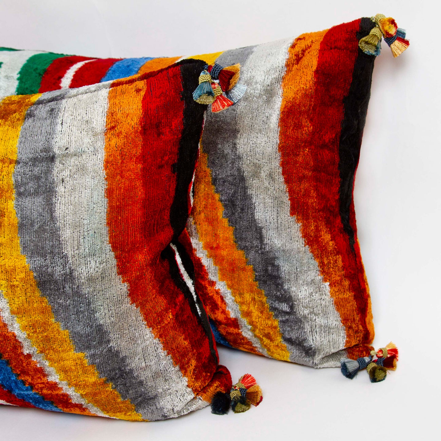 Detail of multicolored tassels, handwoven in Uzbekistan, 15x34 silk velvet ikat lumbar pillow.