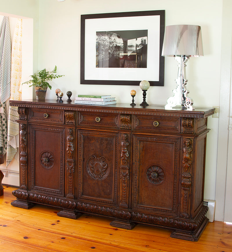 17th-century Florentine credenza in walnut with intricate carvings, original bronze hardware, three doors, drawers, and secret compartments. Dimensions: 80”W x 21”D x 45”H.