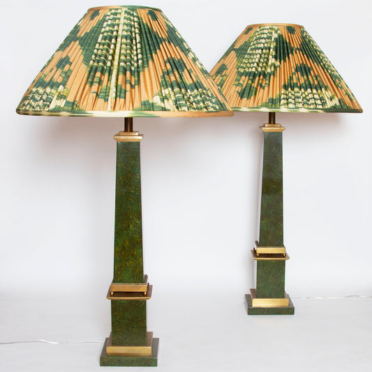 Vintage brass obelisk lamps with faux-marble painted sides, measuring 37” H x 6” W x 6” D.