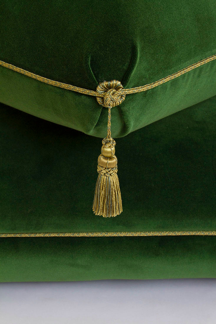 Tassel detail on Turkish Ottoman in solid velvet with knotted trim, tuft, and tassel detailing. Dimensions 33”L x 33”W x 18”H.