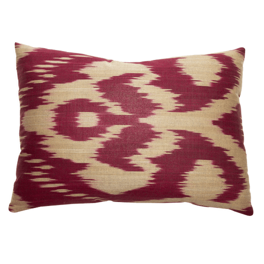 Handwoven cotton and silk ikat pillow with a rich burgundy and tan design; solid tan woven linen on the back.