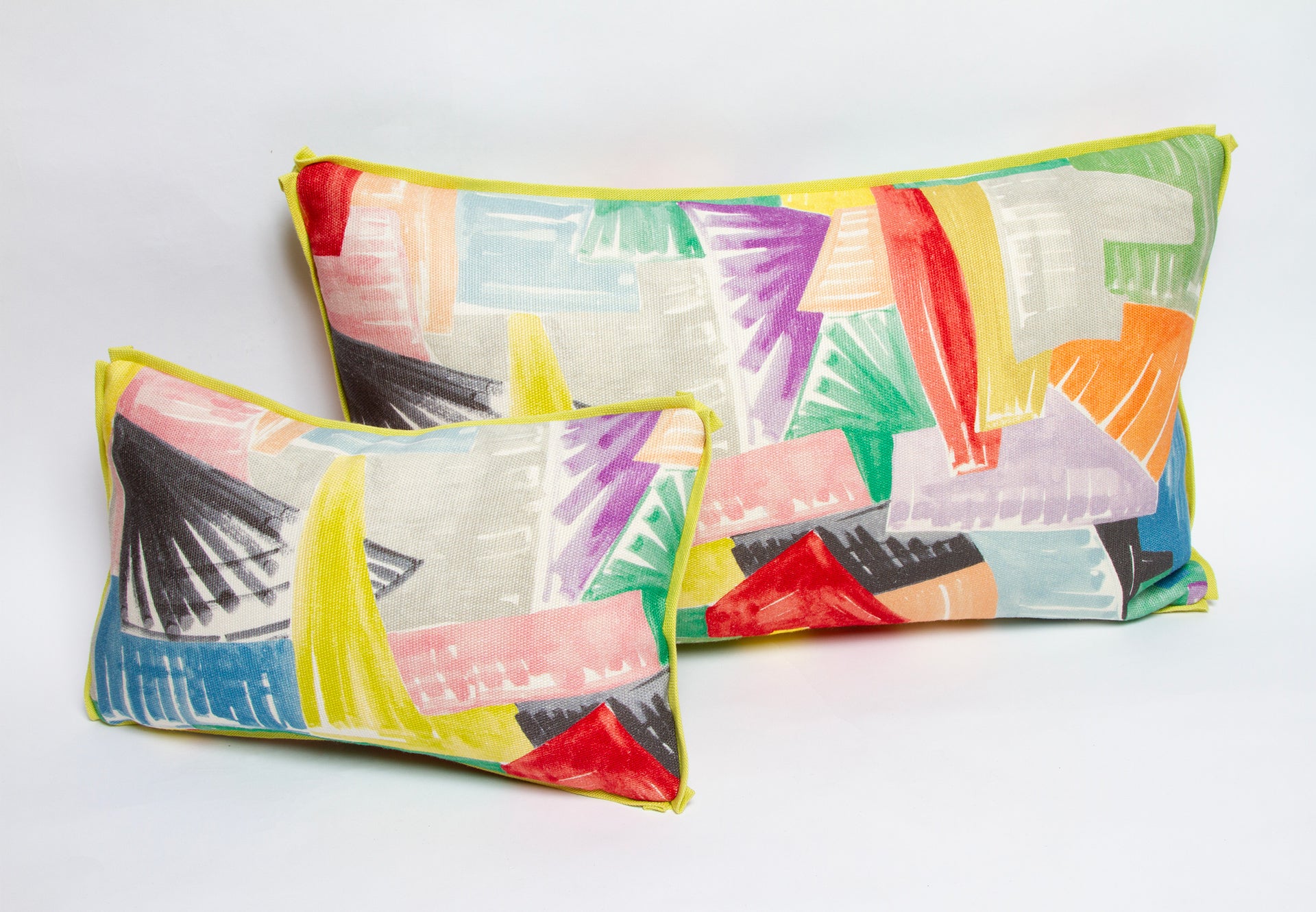 Clarence House Aimee pillows in hemp and linen with chartreuse flange, available in 10” x 16” or 15” x 25”.