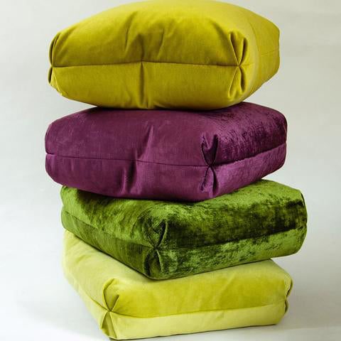 Double-sided pillows in kiwi-colored cotton/polyester velvet with blind seams and tailored Turkish corner detailing.