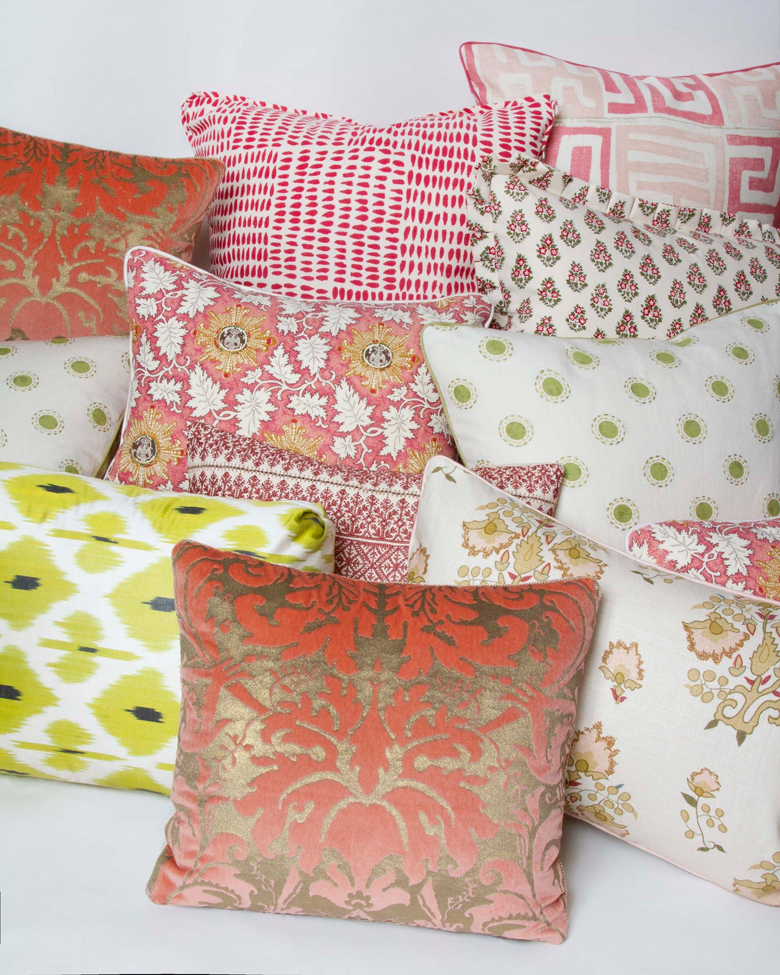 Raoul Textiles ‘Marco’ pillow in Rouge linen, 14” x 18”, starburst and leaves design, Belgian linen back in pink with other pillows.