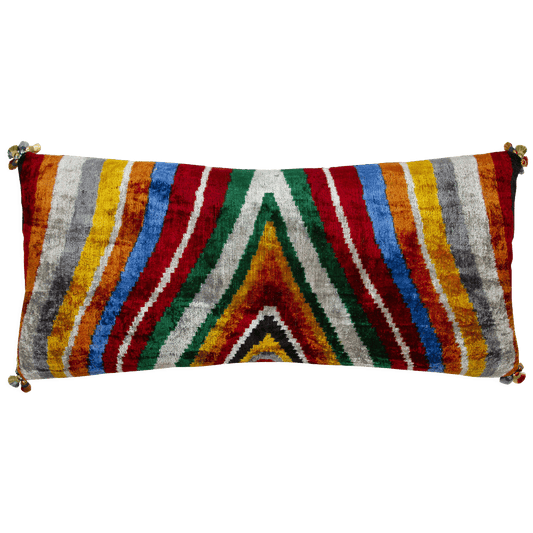 15x34 silk velvet ikat lumbar pillow with multicolored tassels, handwoven in Uzbekistan, perfect for a sofa or bed.