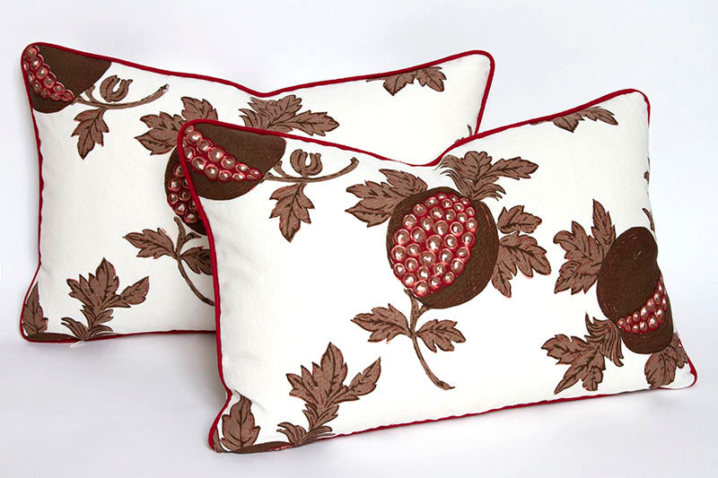 Pomegranate print pillows in espresso, tan, and cranberry colors, with woven cranberry linen cord in seams; leaf swirl design.