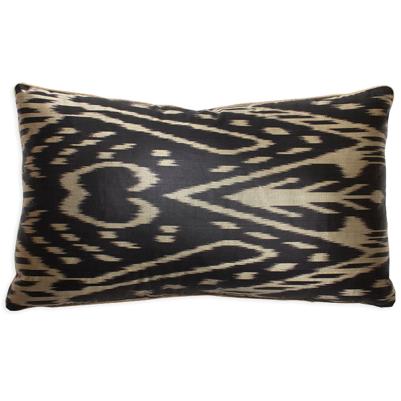 Black and ecru hand-woven silk and cotton ikat pillow with ecru braided cord and black velvet back, perfect for an armchair.