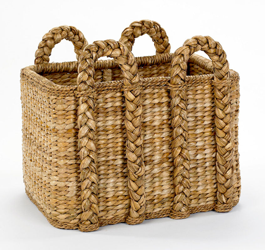 Rectangular rush fireplace basket with a solid rattan frame, woven sweater weave, and dimensions of 25.5”L x 20”W x 18”H.