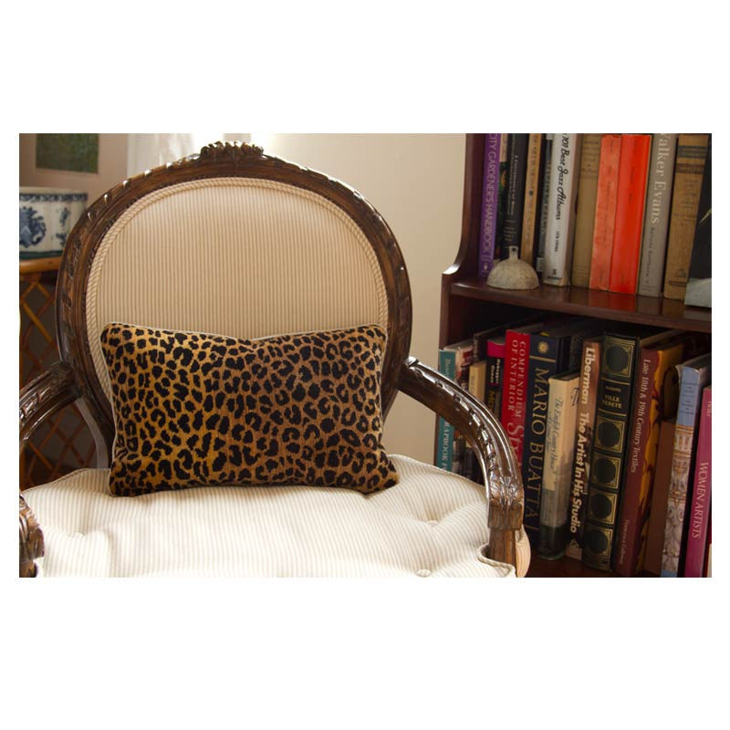 Clarence House Gold Leopard Velvet pillow on a chair