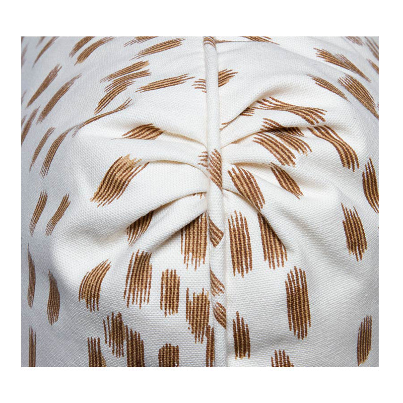 Pleated corner detail on Les Touches abstract animal print pillow in tan on ivory cotton.