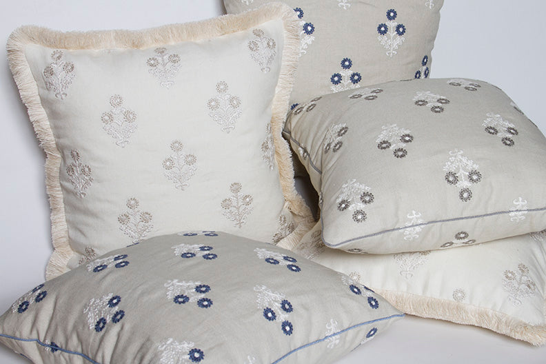 Dove and white embroidered flowers on natural linen, braided dove gray cord, double-sided, hidden zipper with other pillows.