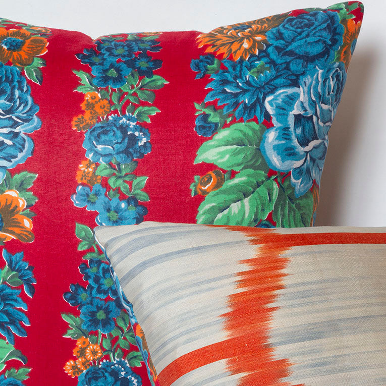 Reversible Miel Blue Rose and Red ikat pillow, handwoven fabric from Uzbekistan, with vintage Russian printed fabric back.